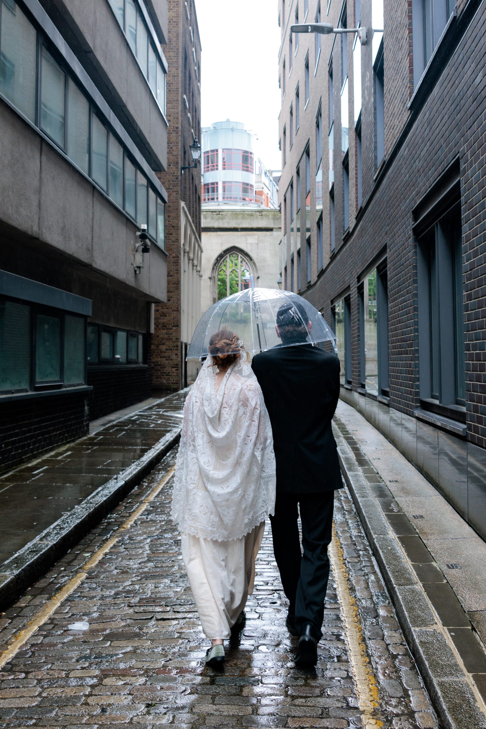 An intimate elopement among the ivy-covered ruins of St Dunstan in the East. Fashion-forward, documentary-style destination wedding photography.